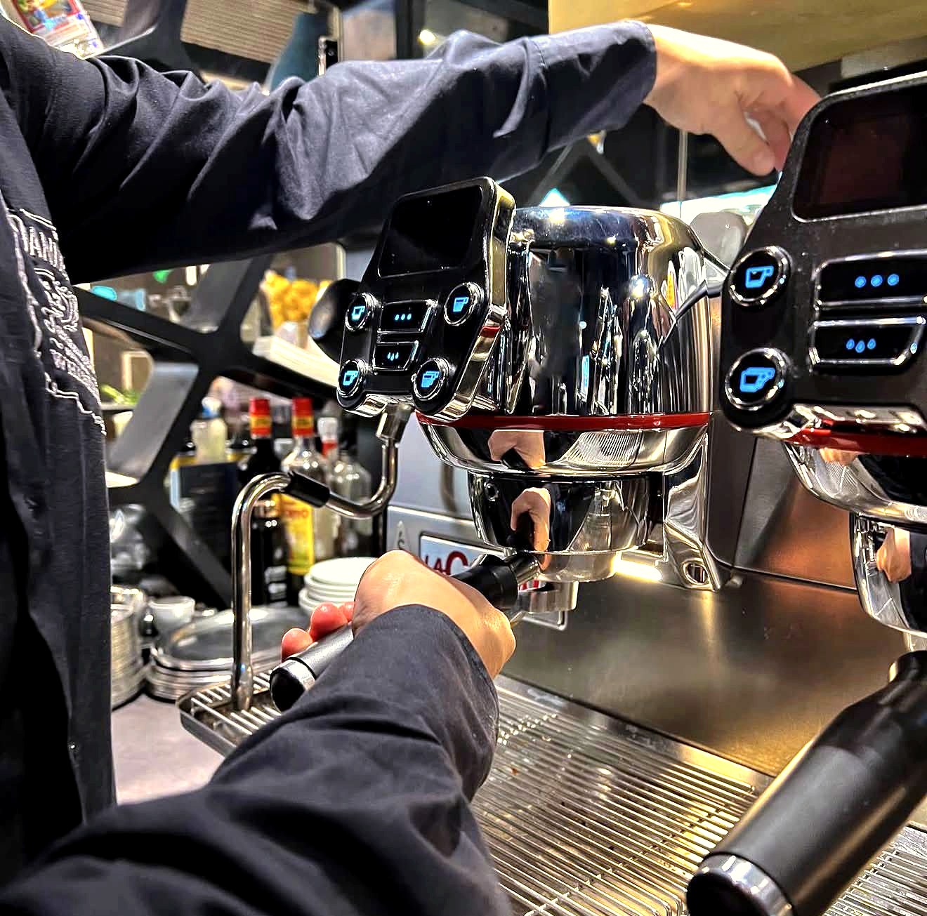 Barista pulling an espresso shot on the machine at daylounge